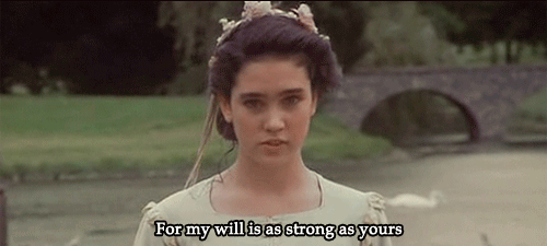Sarah from Labyrinth, a teenage girl with brunette hair, wearing a medieval princess costume in a park and saying "For my will is as strong as yours".
