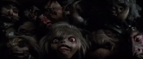 A gang of goblins gasp. They have grotesque faces, wide eyes and fangs.