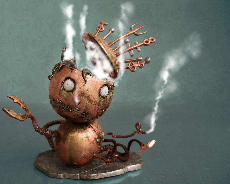 Broken copper-coloured robot with a crown. Steam is pouring from the robot as it melts.