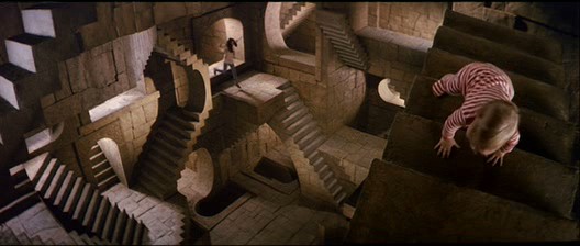 A girl leaps into a room full of stone staircases leading in different directions. In the foreground, a baby in a red and white onesie crawls away from her.