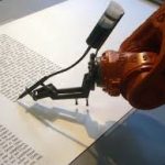 A robot hand writing on paper